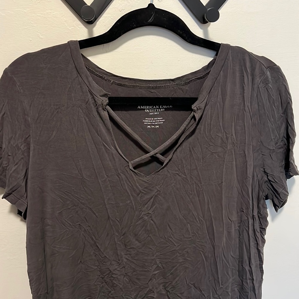 Dark grey American eagle tee shirt with criss cross detail